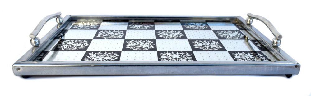 A rectangular Art Deco chrome drinks tray featuring a black and white checkerboard mirrored glass surface decorated with floral motifs and geometric dots. View V