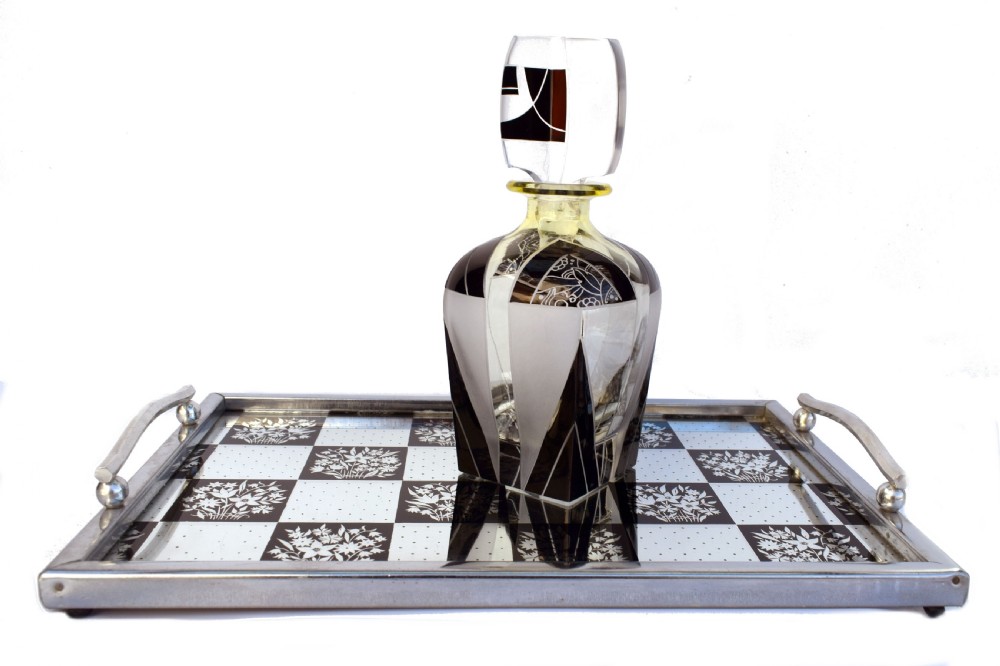 A rectangular Art Deco chrome drinks tray featuring a black and white checkerboard mirrored glass surface decorated with floral motifs and geometric dots. View VI