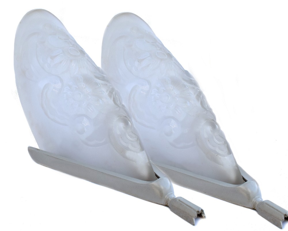 A matching pair of French Art Deco wall sconces featuring tapered frosted glass shades with raised floral relief patterns set into metal mounts. View IX