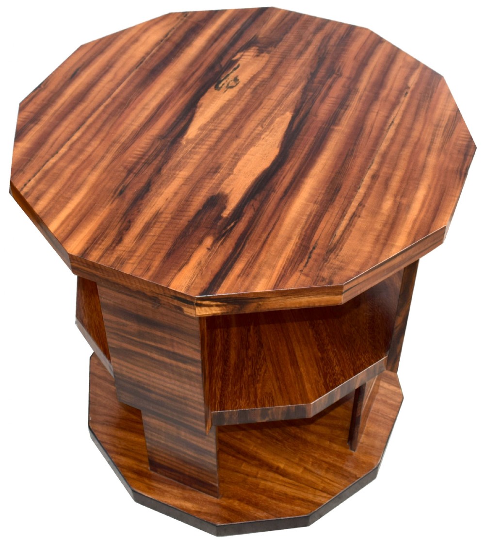 An octagonal three-tiered Art Deco revolving book table crafted from dark striped wood veneer. View III