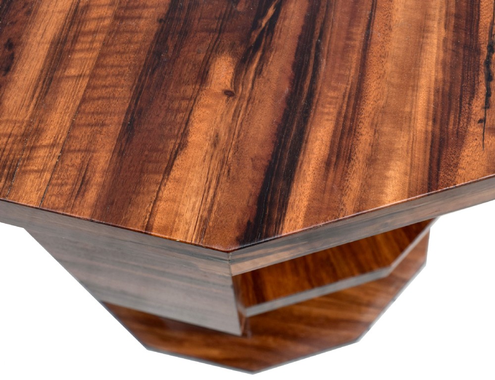 An octagonal three-tiered Art Deco revolving book table crafted from dark striped wood veneer. View V