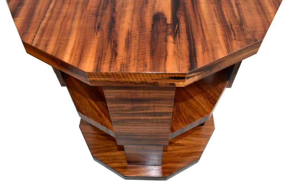 An octagonal three-tiered Art Deco revolving book table crafted from dark striped wood veneer. View VI