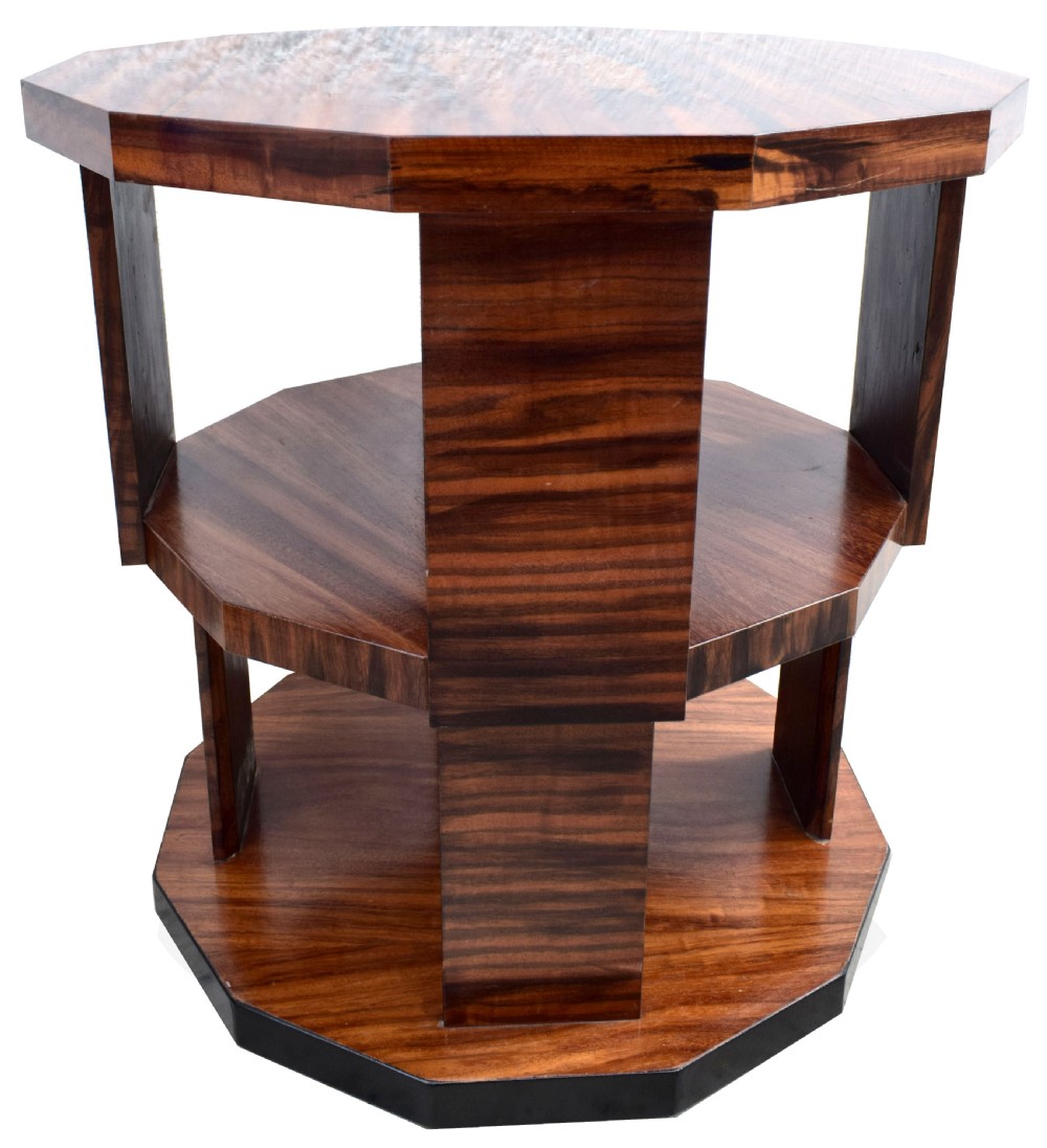 An octagonal three-tiered Art Deco revolving book table crafted from dark striped wood veneer. View VII