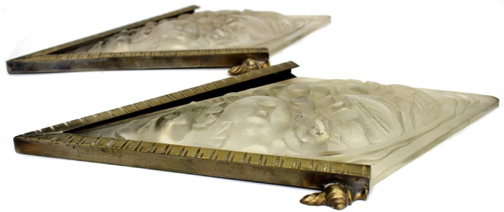 A pair of diamond-shaped Art Deco wall sconces featuring frosted glass with fruit relief designs held in incised bronze mounts. View VI