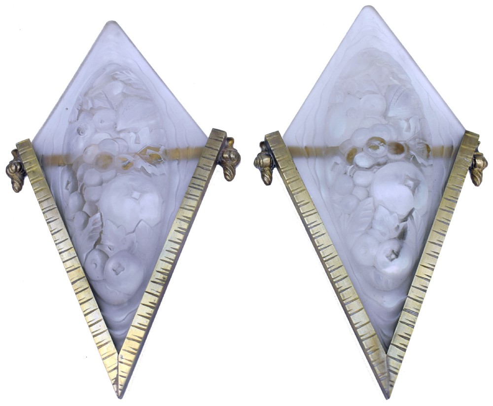 A pair of diamond-shaped Art Deco wall sconces featuring frosted glass with fruit relief designs held in incised bronze mounts. View VII