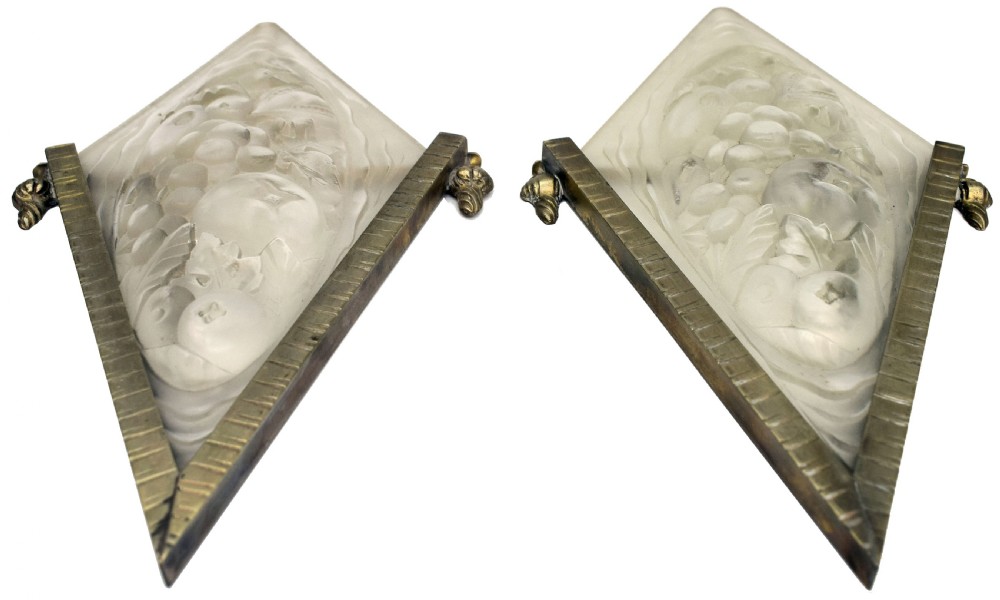 A pair of diamond-shaped Art Deco wall sconces featuring frosted glass with fruit relief designs held in incised bronze mounts. View IX