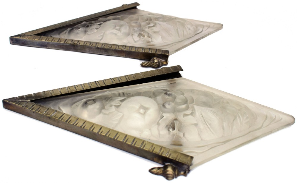 A pair of diamond-shaped Art Deco wall sconces featuring frosted glass with fruit relief designs held in incised bronze mounts. View XI