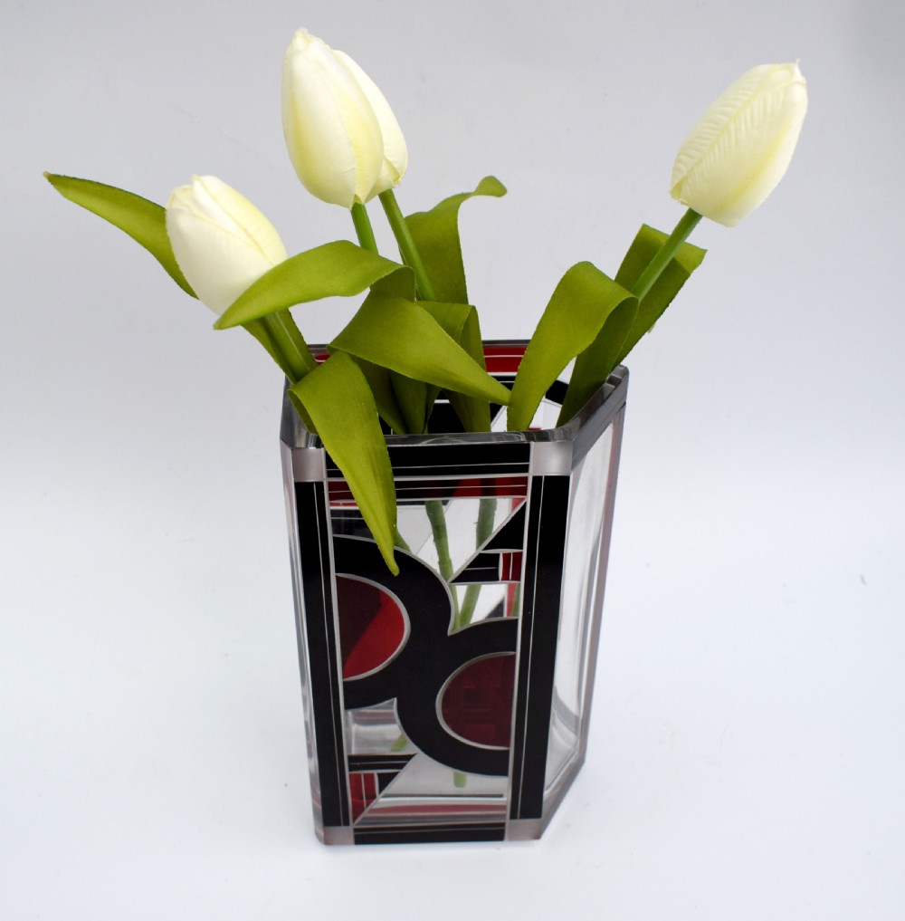 A rectangular clear glass Art Deco vase featuring geometric black and red enamel patterns. View III