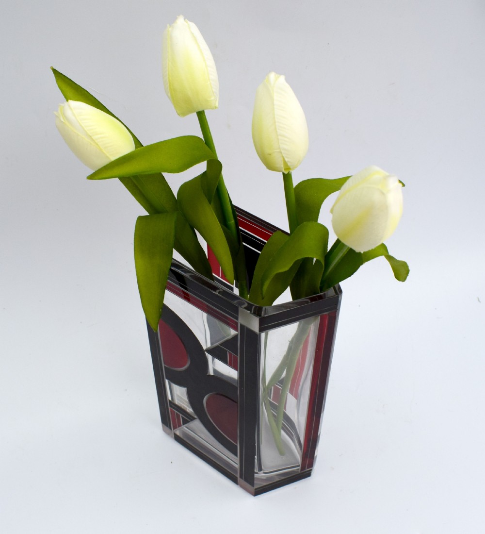 A rectangular clear glass Art Deco vase featuring geometric black and red enamel patterns. View V