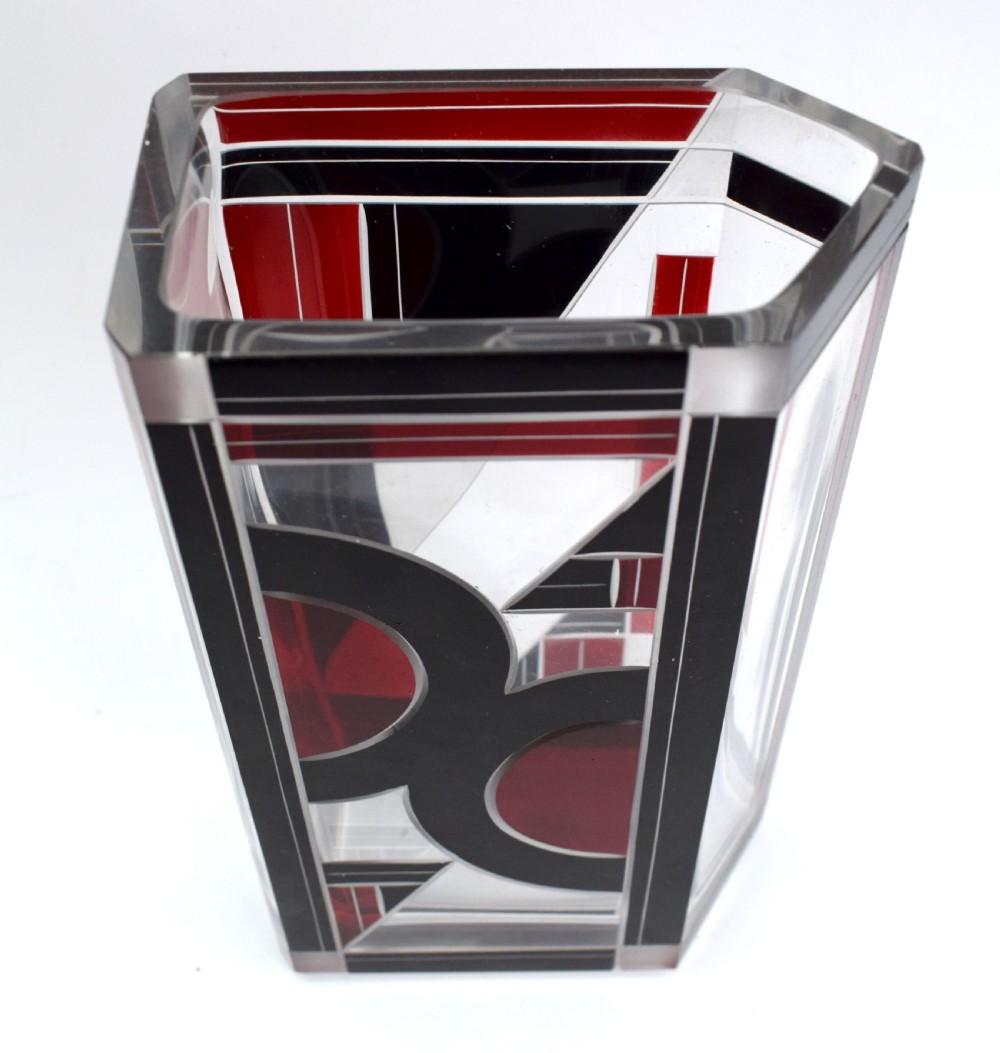 A rectangular clear glass Art Deco vase featuring geometric black and red enamel patterns. View VII