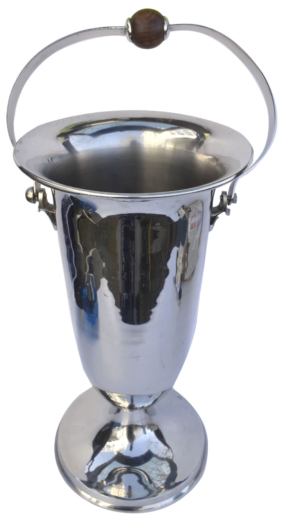 A tall polished chrome ice bucket featuring a pedestal base, flared top rim, and a curved swing handle with a turned wooden centre knob.