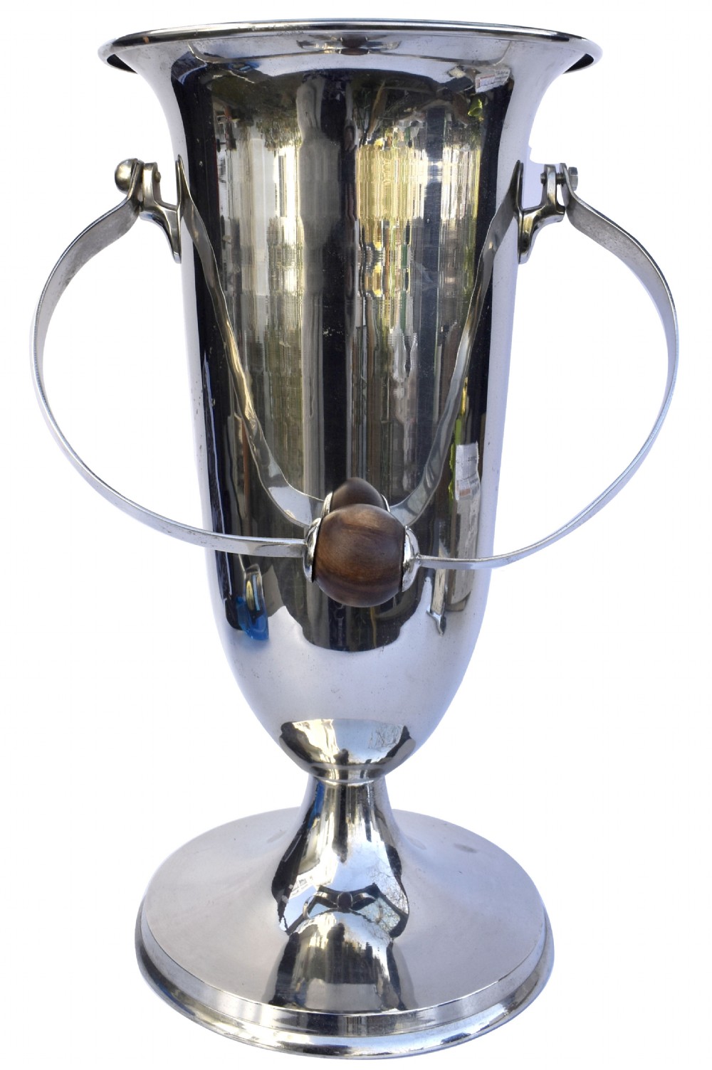 A tall polished chrome ice bucket featuring a pedestal base, flared top rim, and a curved swing handle with a turned wooden centre knob. View II