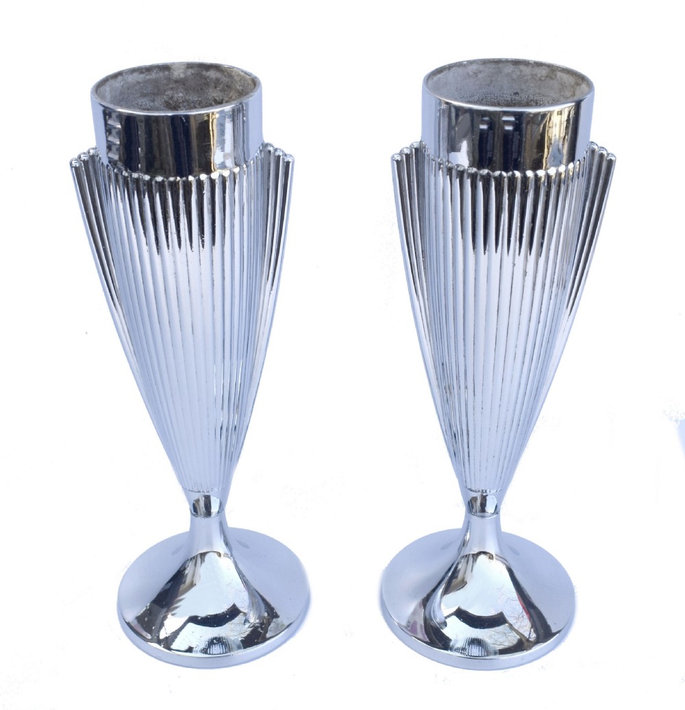 A pair of polished chrome Art Deco vases featuring fluted conical bodies set upon flared pedestal bases. View II