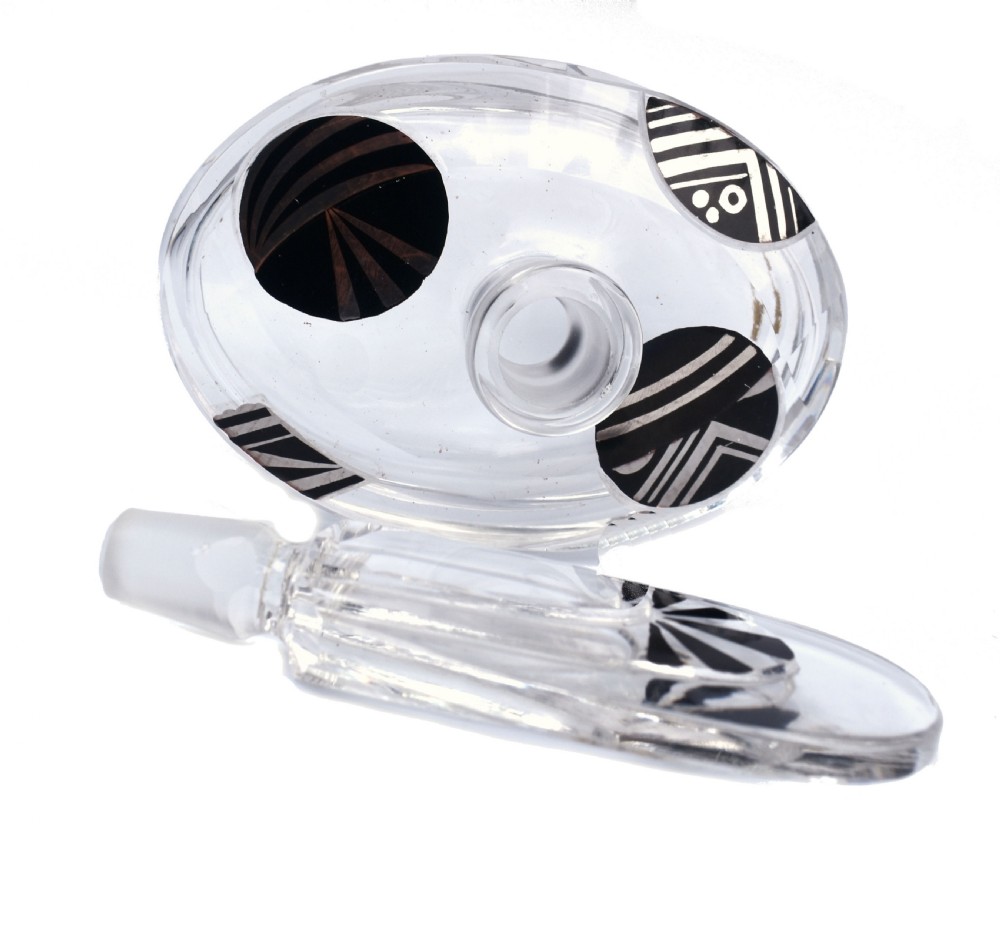 An Art Deco clear glass perfume bottle with angular cut facets, black enamelled fan details, and a matching tall stopper. View III