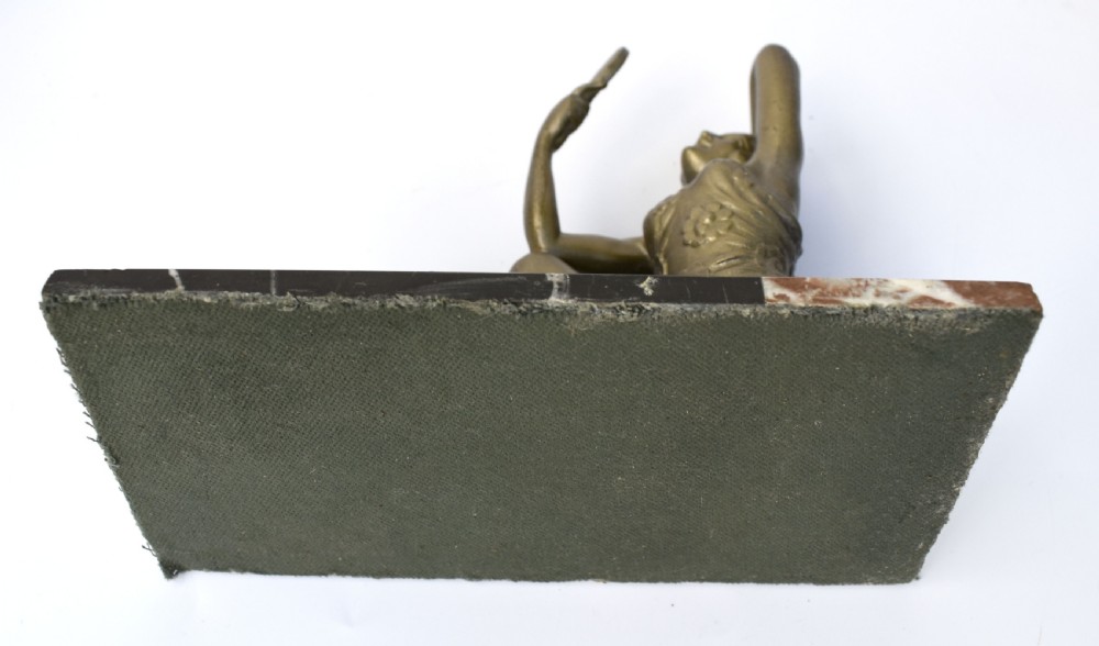 An Art Deco patinated metal figure of a seated woman holding a hand mirror, resting on a marble base. View IV