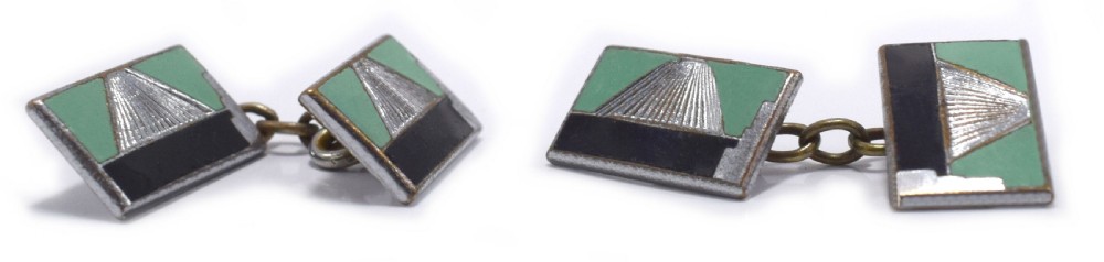 A pair of rectangular Art Deco cufflinks featuring green and black enamel with a central silver sunburst motif, connected by chain links. View II