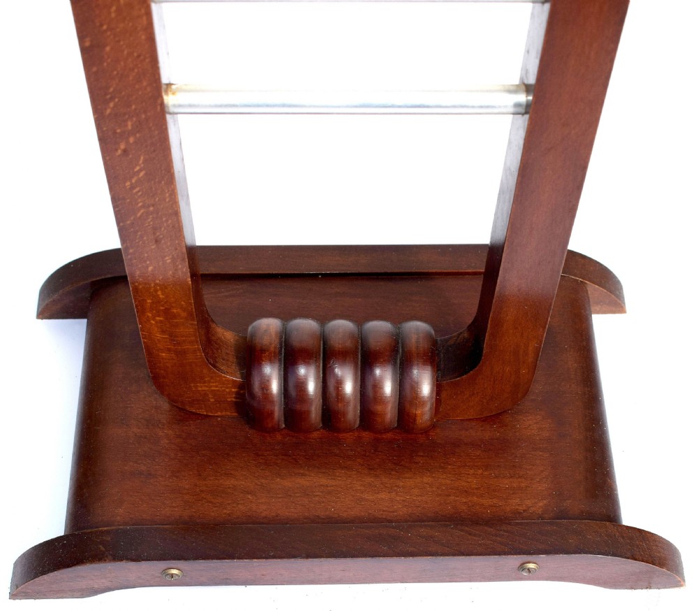 An Art Deco wooden cantilever sewing box on a pedestal stand with metallic joint brackets and cylindrical handles. View IV