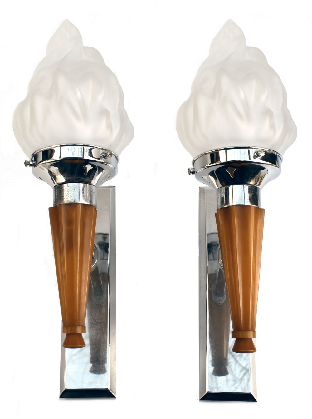 A pair of Art Deco wall sconces featuring frosted flame-shaped glass shades supported by chrome mounts and amber Bakelite handles on polished rectangular backplates.