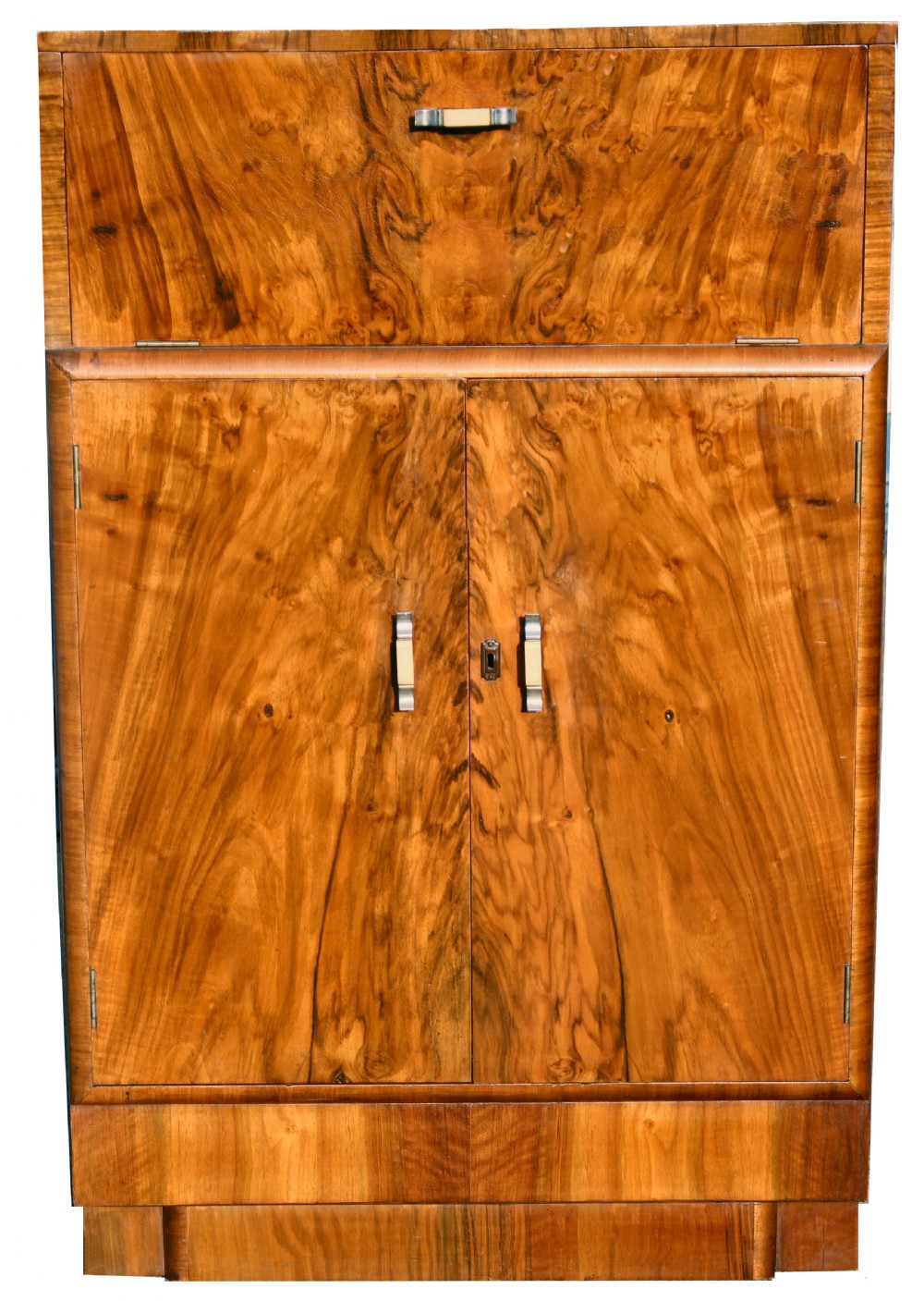 An Art Deco walnut cocktail cabinet featuring figure-matched timber grain, a drop-front upper section, double lower doors, and streamlined handles.