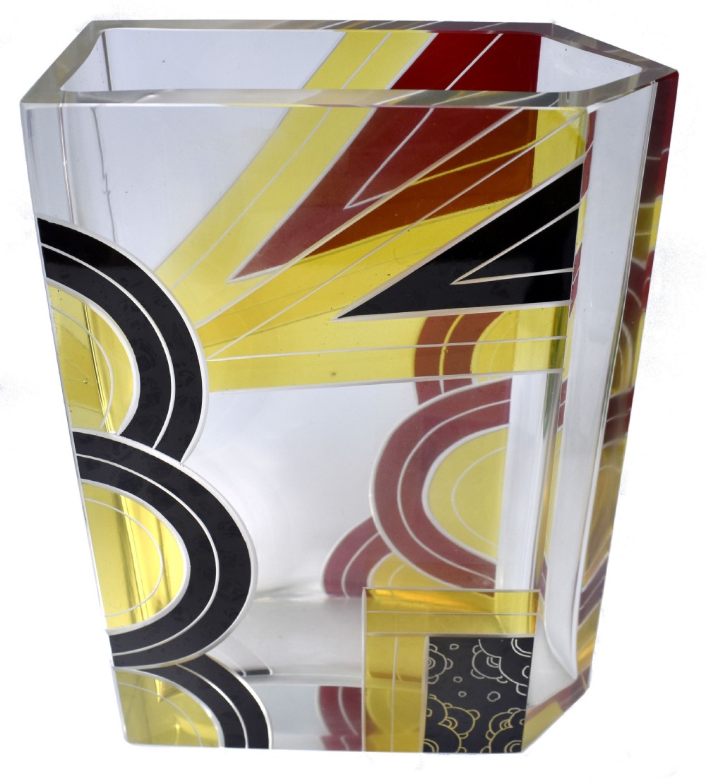 A rectangular clear glass Art Deco vase decorated with etched patterns and enamelled geometric shapes in black, yellow, and red. View VI