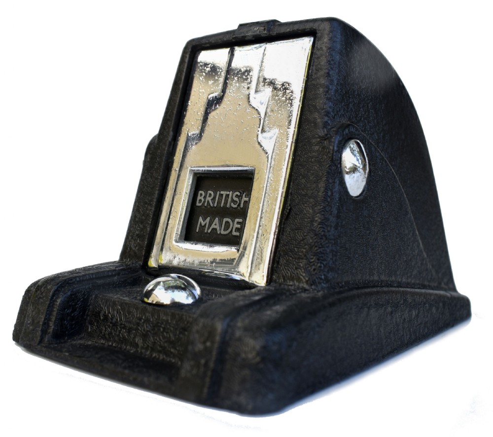 A black textured Bakelite and chrome Art Deco perpetual desk calendar featuring a geometric stepped frame with the text BRITISH MADE displayed.