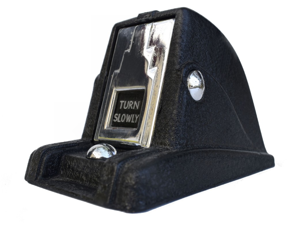 A black textured Bakelite and chrome Art Deco perpetual desk calendar featuring a geometric stepped frame with the text BRITISH MADE displayed. View II