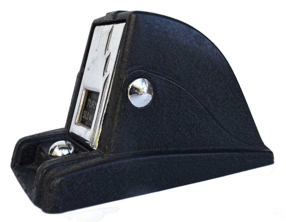A black textured Bakelite and chrome Art Deco perpetual desk calendar featuring a geometric stepped frame with the text BRITISH MADE displayed. View IV