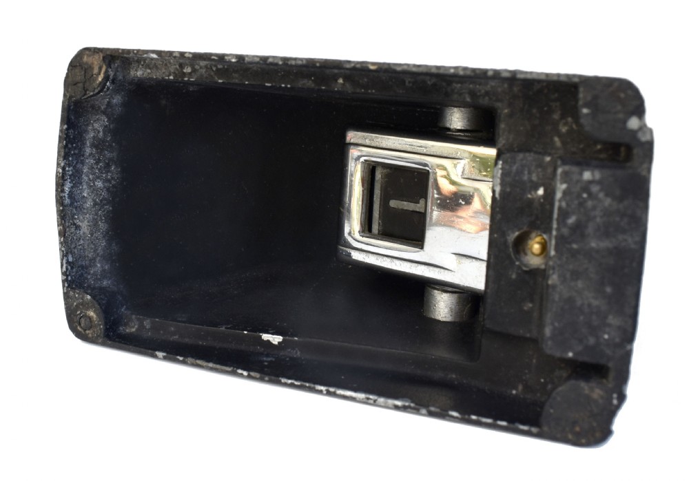 A black textured Bakelite and chrome Art Deco perpetual desk calendar featuring a geometric stepped frame with the text BRITISH MADE displayed. View IX