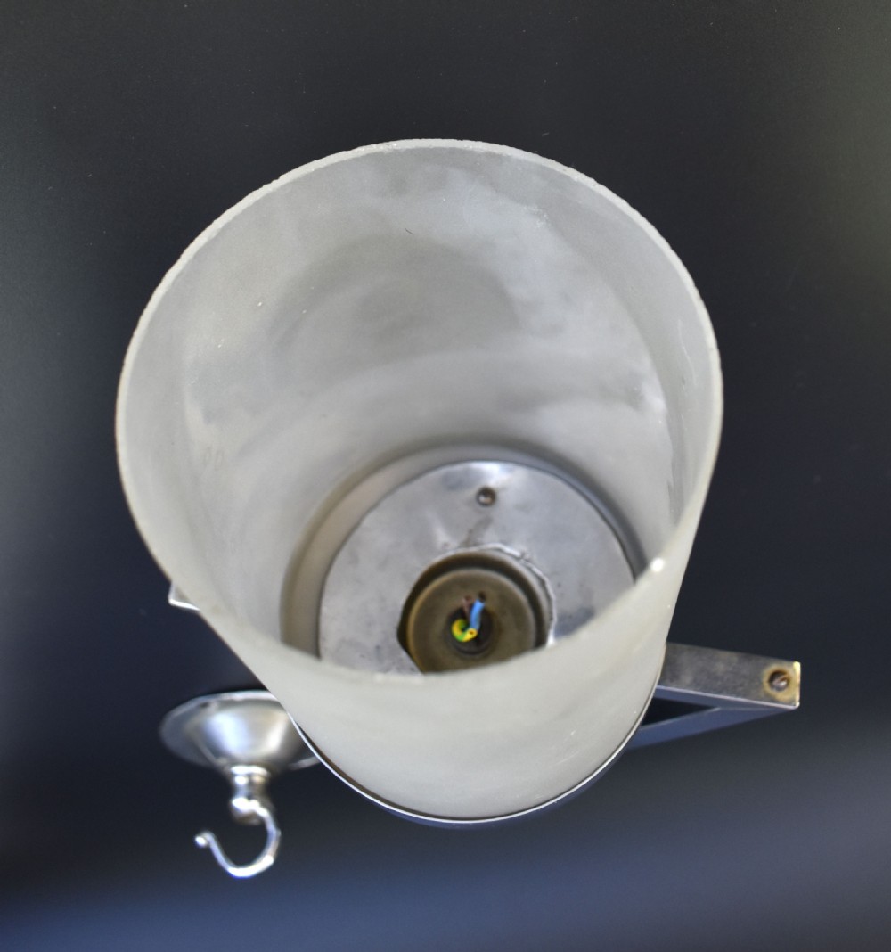 An Art Deco pendant ceiling light featuring a polished chrome triangular suspension frame and spherical detailing above a cylindrical frosted glass shade. View VI