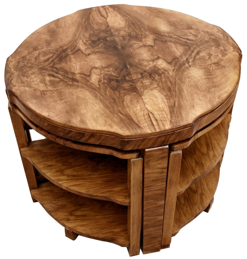 An Art Deco circular walnut coffee table housing four matching triangular side tables beneath its top. View VII