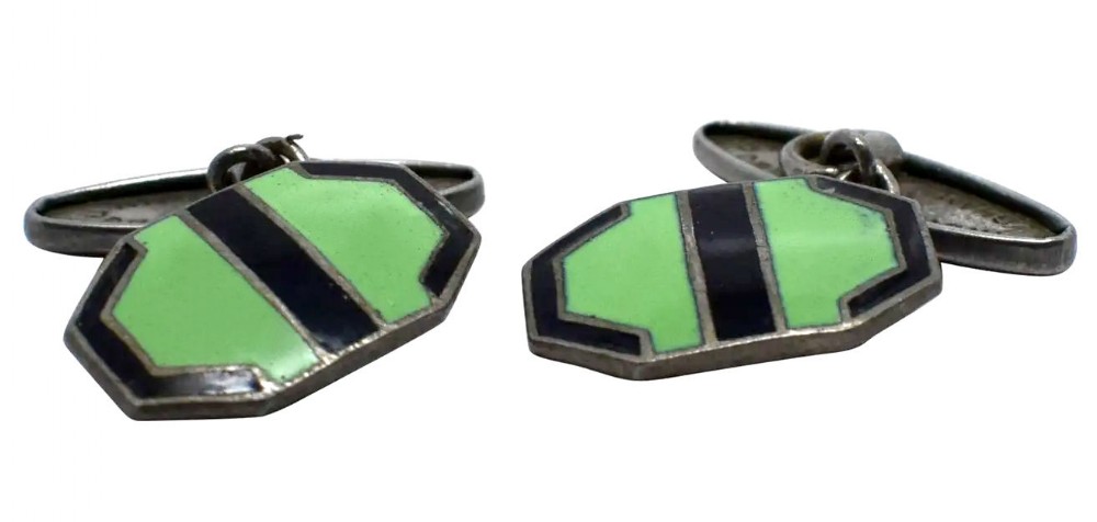 A pair of Art Deco sterling silver cufflinks with geometric octagonal faces decorated in green enamel and a central black stripe.