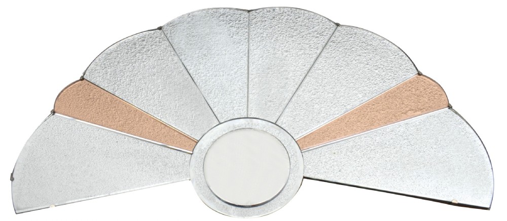 An Art Deco fan-shaped frameless wall mirror featuring segmented silvered textured glass panels and peach-tinted glass accents radiating from a central disc.