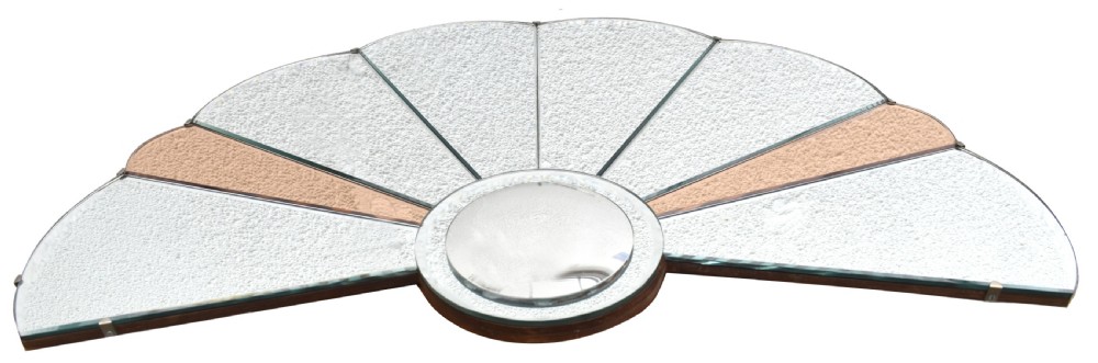 An Art Deco fan-shaped frameless wall mirror featuring segmented silvered textured glass panels and peach-tinted glass accents radiating from a central disc. View II