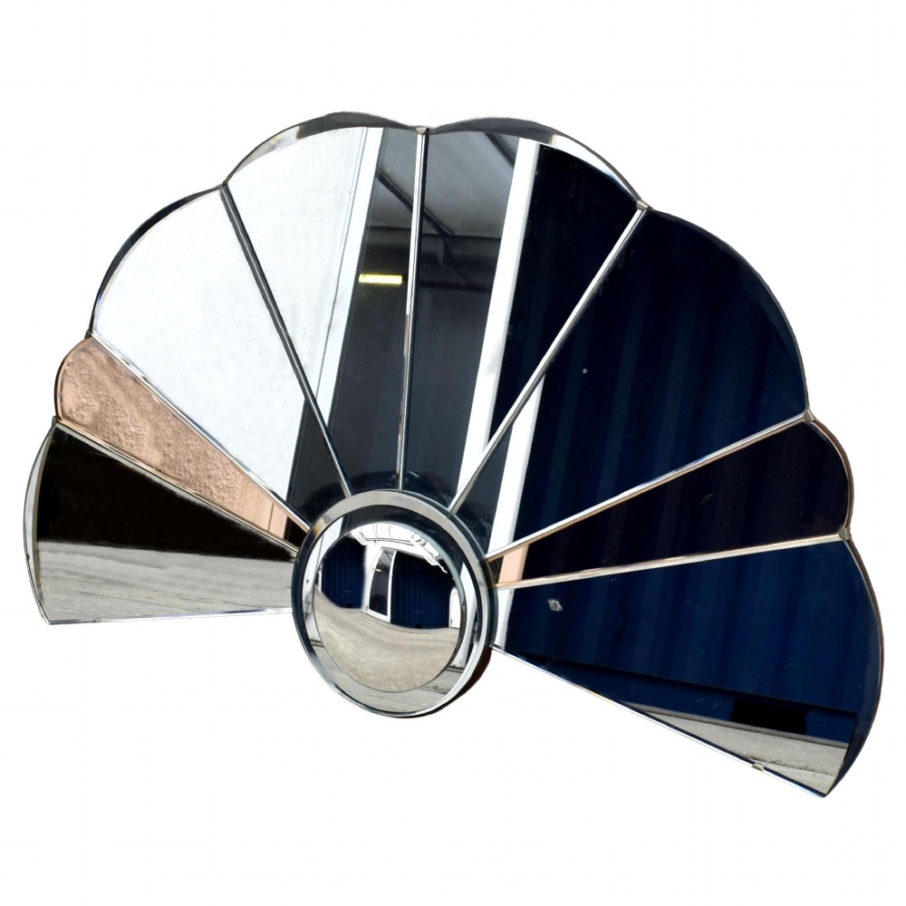 An Art Deco fan-shaped frameless wall mirror featuring segmented silvered textured glass panels and peach-tinted glass accents radiating from a central disc. View III