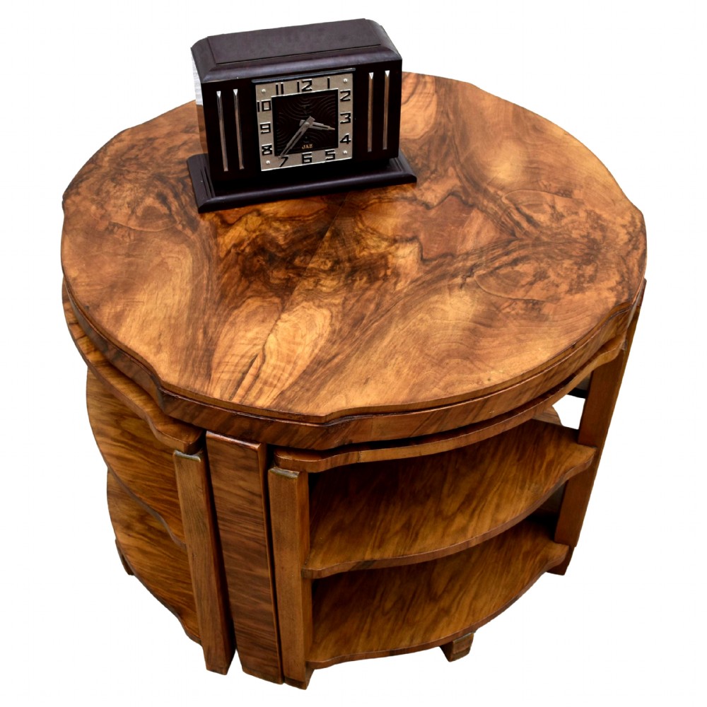 An Art Deco circular walnut coffee table housing four matching triangular side tables beneath its top. View VIII
