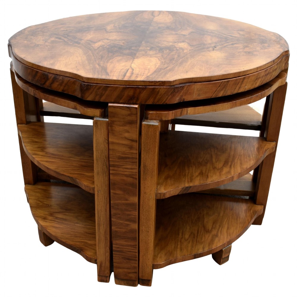 An Art Deco circular walnut coffee table housing four matching triangular side tables beneath its top. View XI