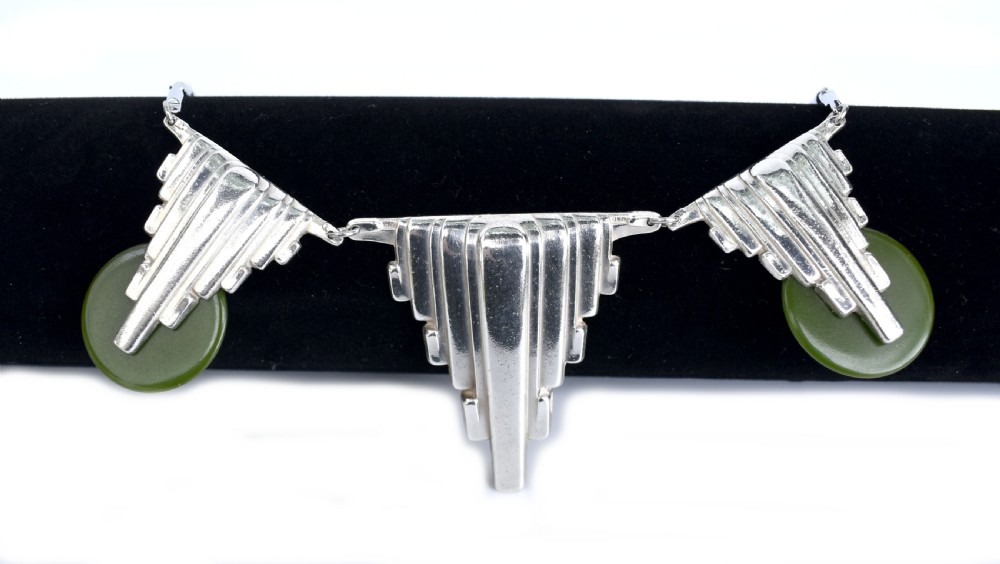 An Art Deco chrome link necklace featuring three stepped geometric metal pendants accented with circular green Bakelite discs. View II