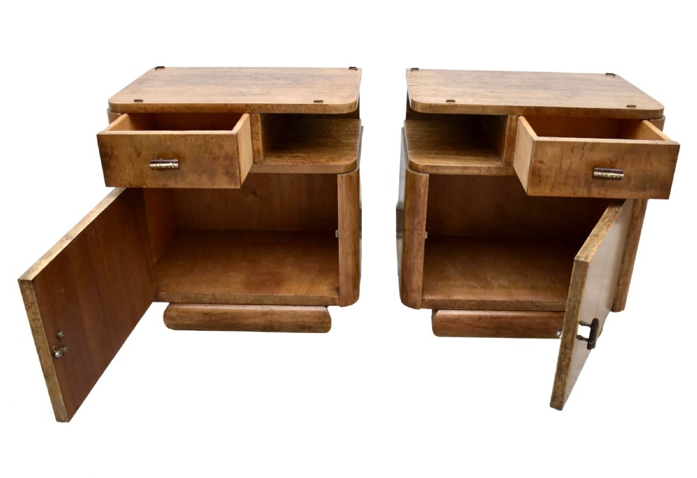 A matching pair of 1930s Art Deco burr elm bedside cabinets featuring top drawers, open compartments, single-door cupboards, and rounded plinth bases. View III