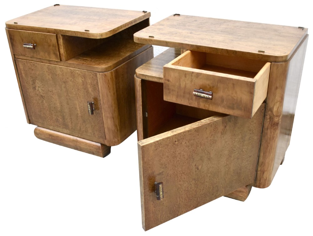 A matching pair of 1930s Art Deco burr elm bedside cabinets featuring top drawers, open compartments, single-door cupboards, and rounded plinth bases. View VII