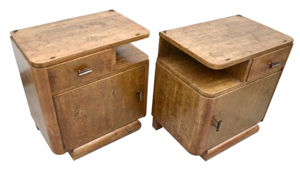 A matching pair of 1930s Art Deco burr elm bedside cabinets featuring top drawers, open compartments, single-door cupboards, and rounded plinth bases. View XI