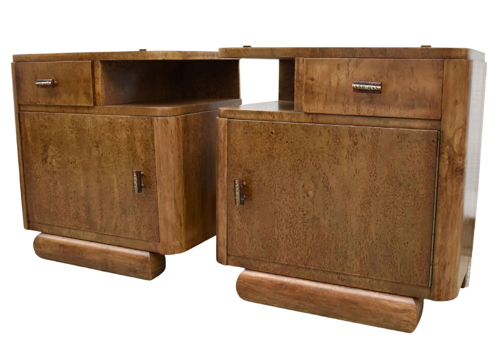 A matching pair of 1930s Art Deco burr elm bedside cabinets featuring top drawers, open compartments, single-door cupboards, and rounded plinth bases. View XII