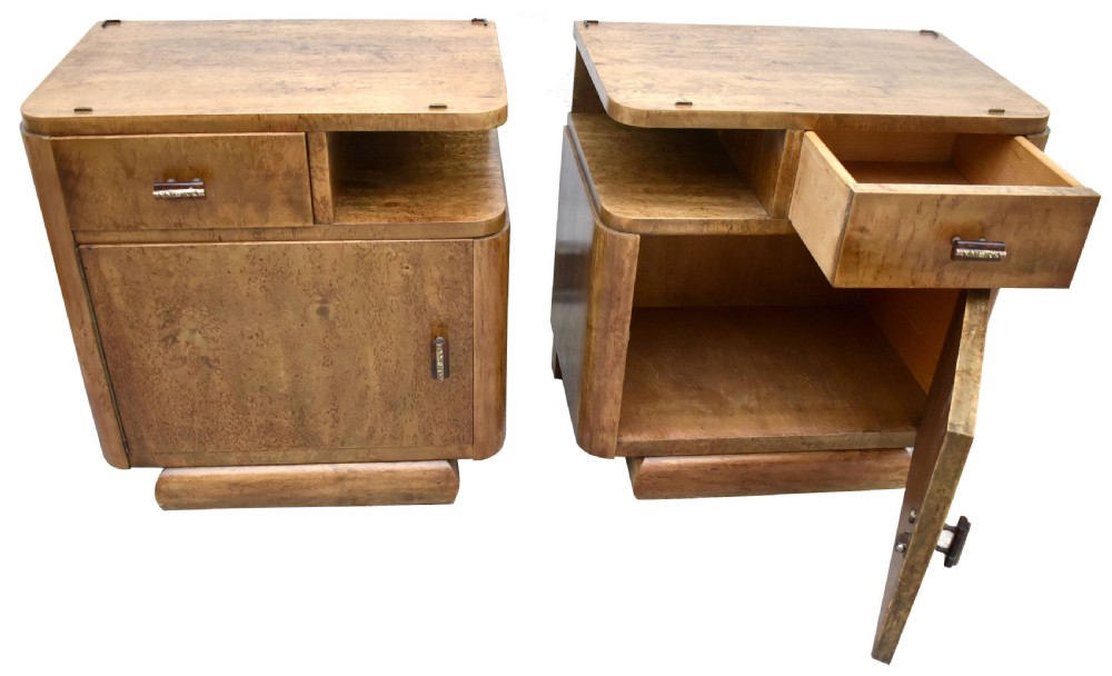 A matching pair of 1930s Art Deco burr elm bedside cabinets featuring top drawers, open compartments, single-door cupboards, and rounded plinth bases. View XV