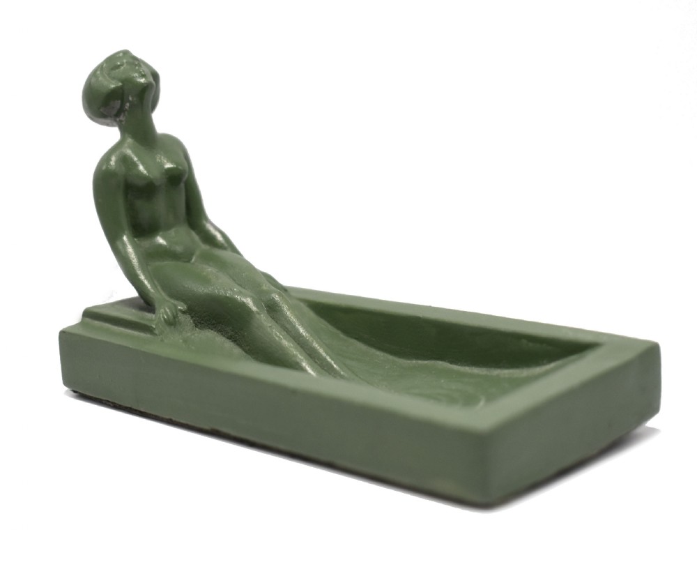 A green Art Deco spelter pin dish featuring a reclining female figure resting along the edge of a small rectangular tray. View III