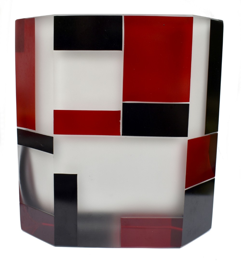 An Art Deco hexagonal opaque glass vase featuring bold red and black geometric enamel motifs. View VI