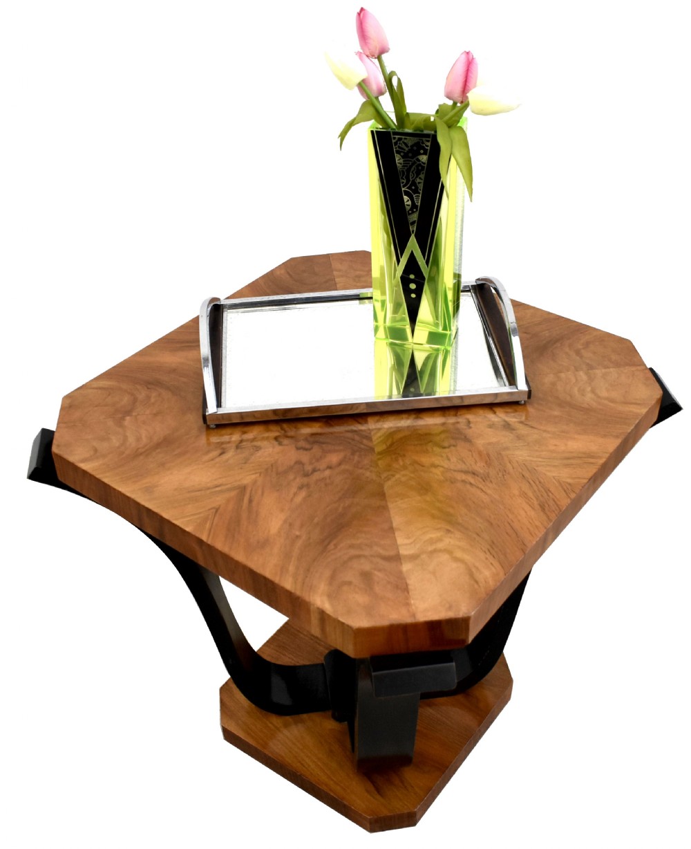 An Art Deco occasional table featuring an octagonal walnut veneer top supported by four curved ebonised legs resting on an octagonal base. View III