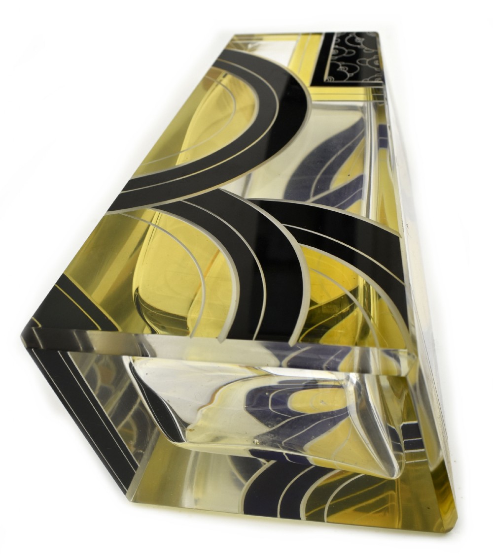 A tall tapered rectangular clear glass vase decorated with black enamel arcs, yellow panels, and etched geometric patterns. View IX