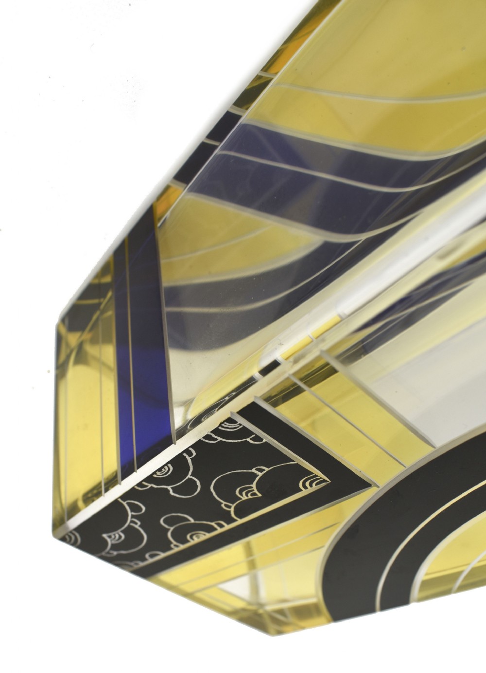 A tall tapered rectangular clear glass vase decorated with black enamel arcs, yellow panels, and etched geometric patterns. View X