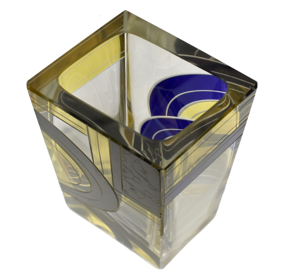 A tall tapered rectangular clear glass vase decorated with black enamel arcs, yellow panels, and etched geometric patterns. View XII