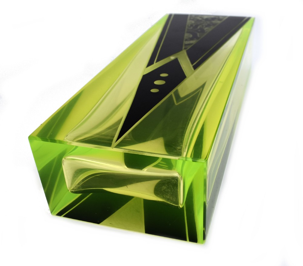 A tall rectangular yellow-green glass vase featuring black geometric Art Deco enamel patterns. View III