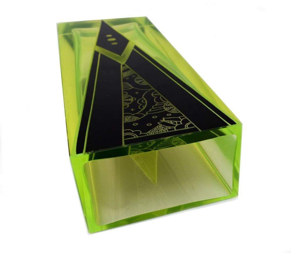 A tall rectangular yellow-green glass vase featuring black geometric Art Deco enamel patterns. View IV